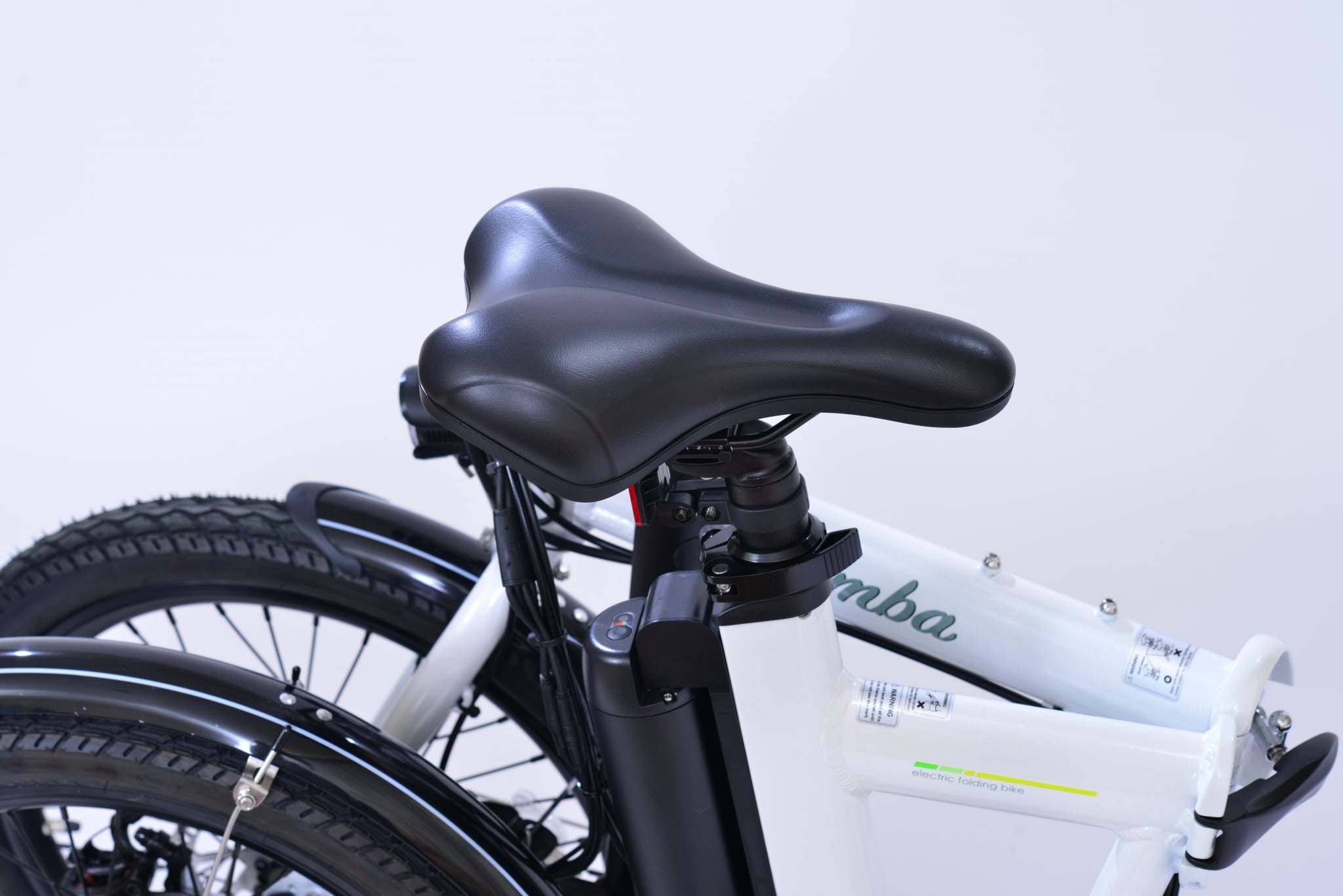 View of a seat post of a white electric folding bicycle.