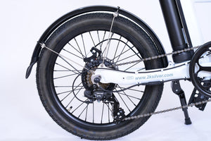 Back wheel of a white folding electric bike.