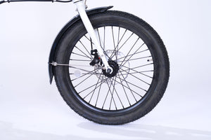 Front wheel of a white folding electric bike.