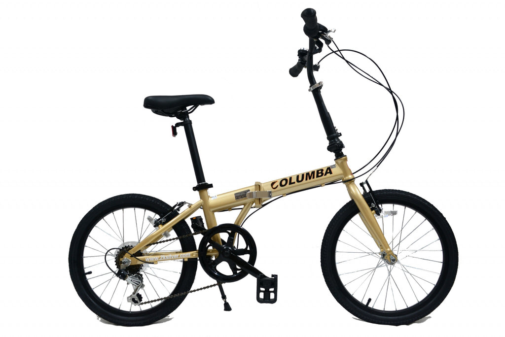 Full view of a gold folding bicycle.