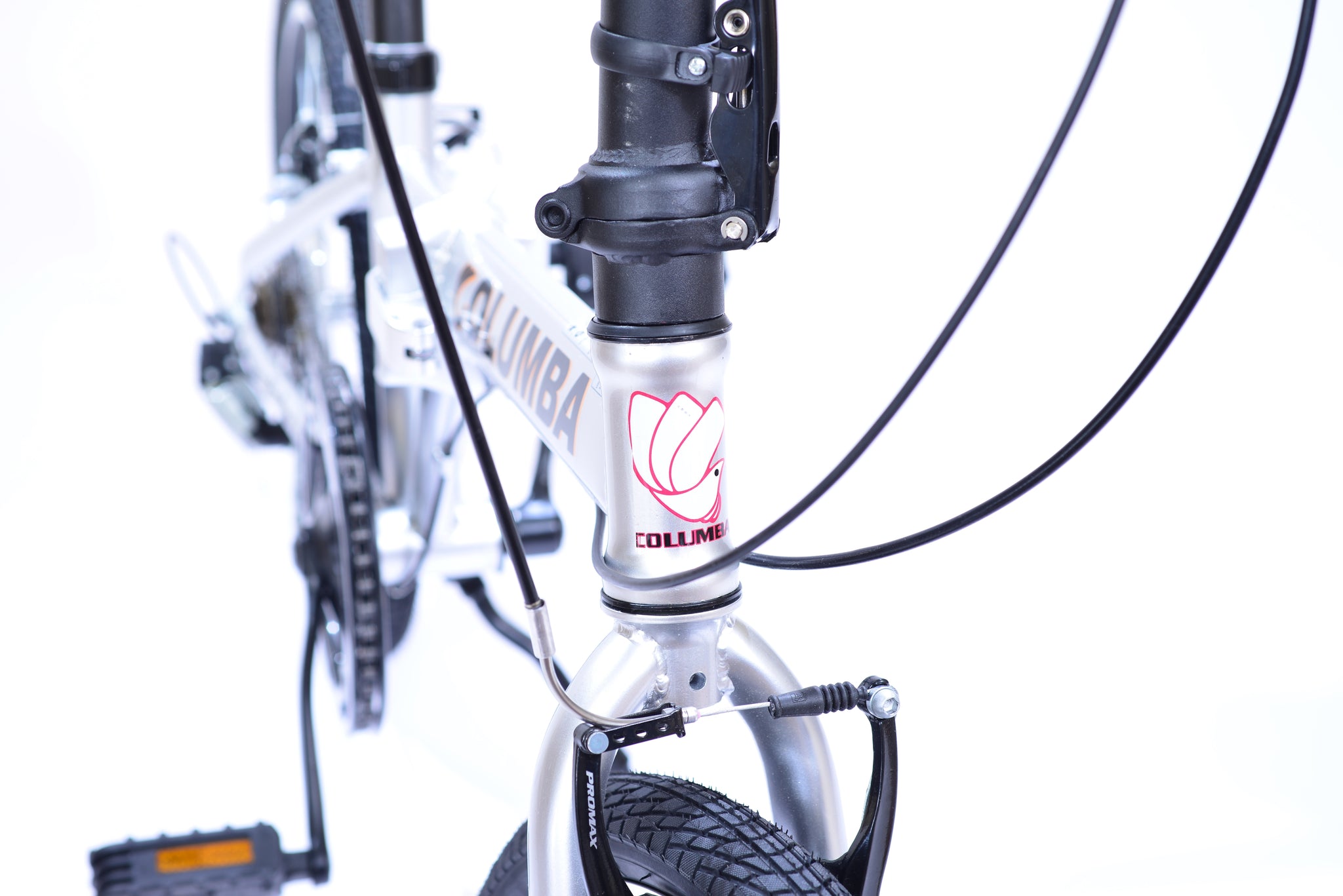 Angled view of the front of a silver bicycle with a red outlined bird icon.