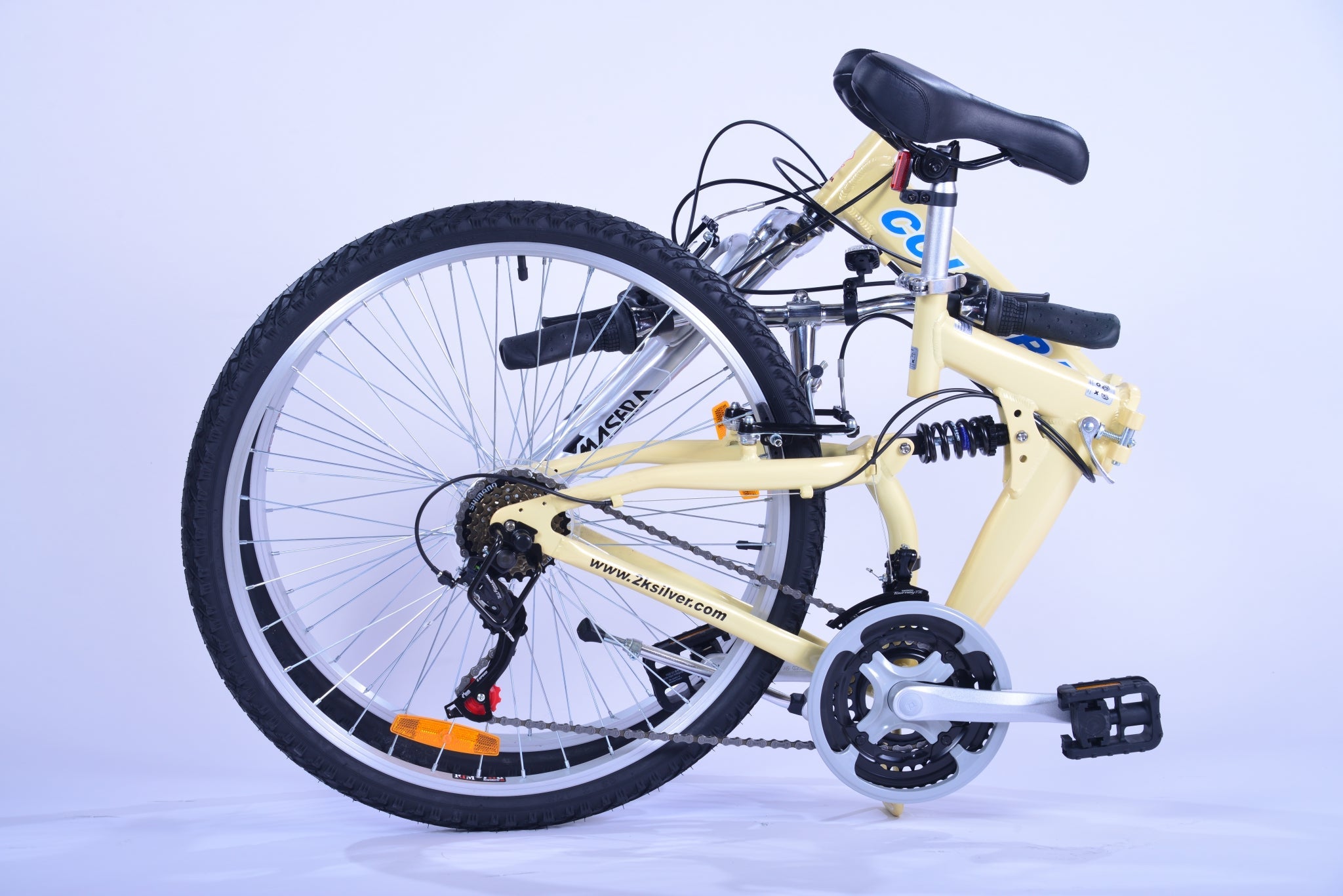 Folded position of a cream colored folding bicycle.