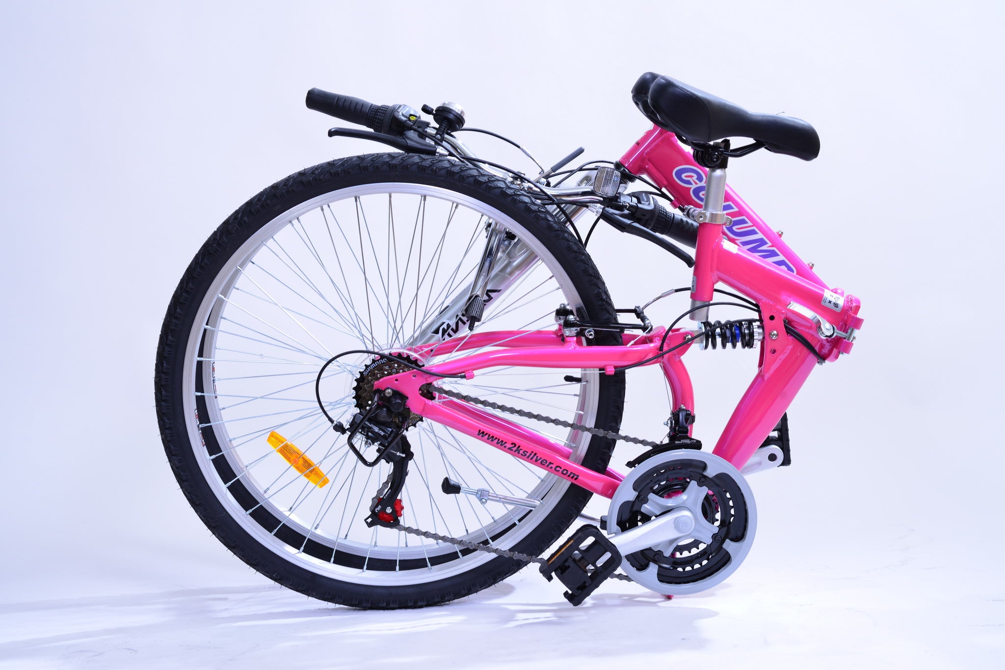 Bright and vibrant pink folding bike in a folded position sitting on the ground.