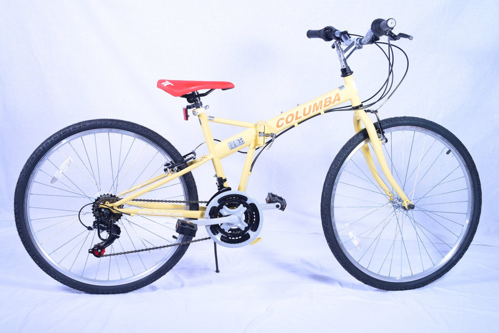 Yellowish-cream colored folding bicycle with a bright red saddle.