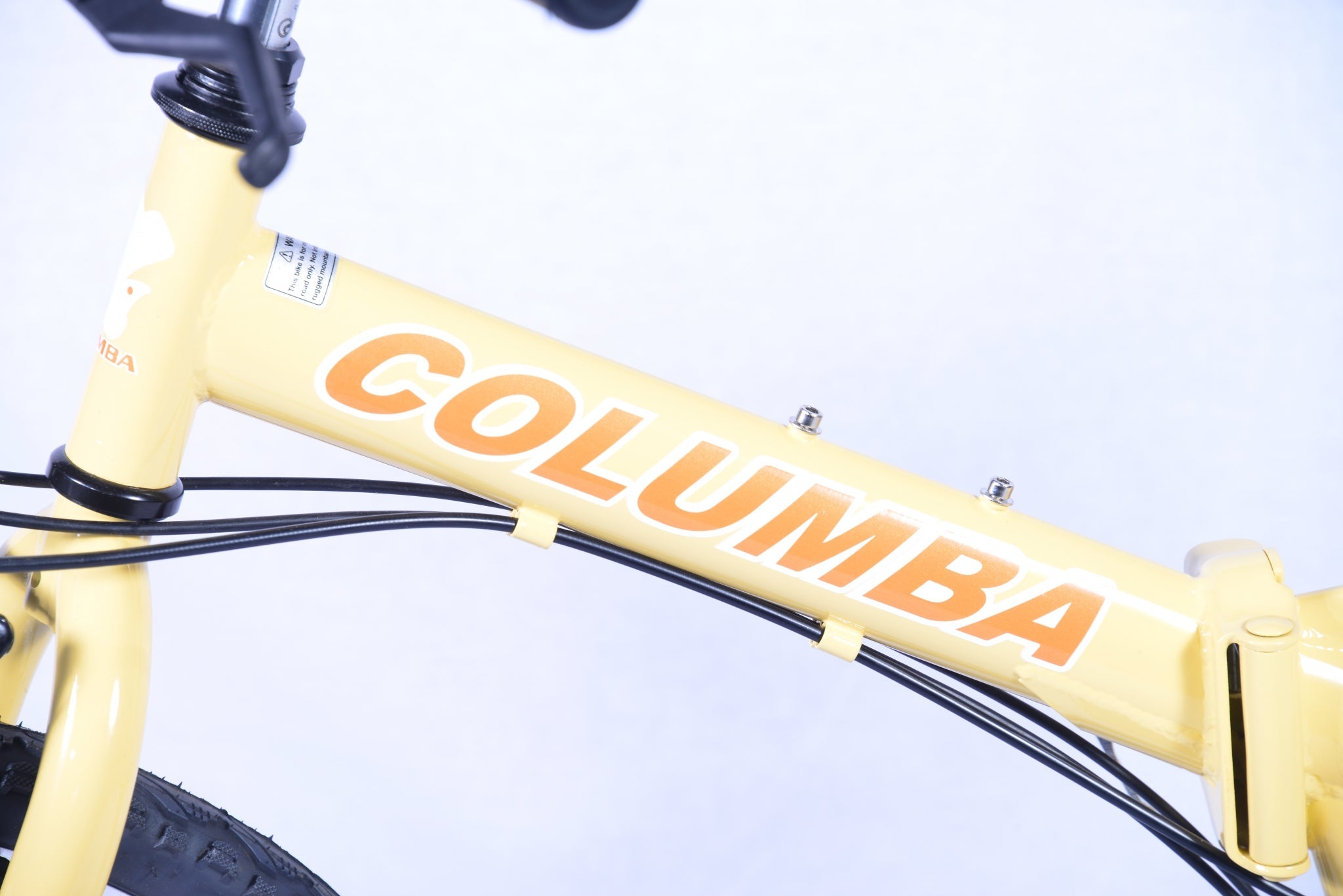 Bike frame of a yellow-colored folding bicycle with an orange and white logo word mark titled "Columba."