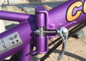 Hinge on a purple folding bicycle.