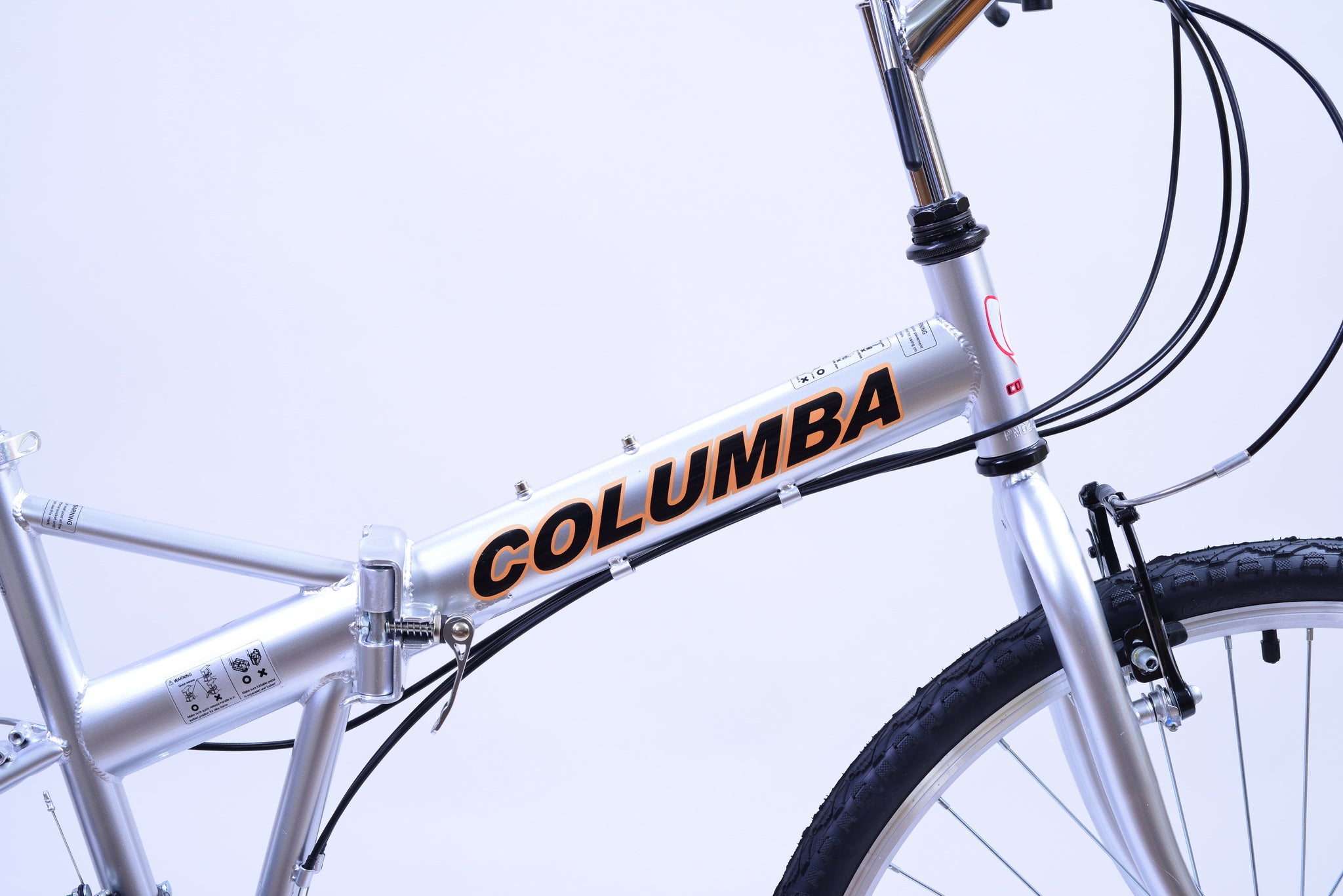 Silver folding bike tube that reads "Columba."